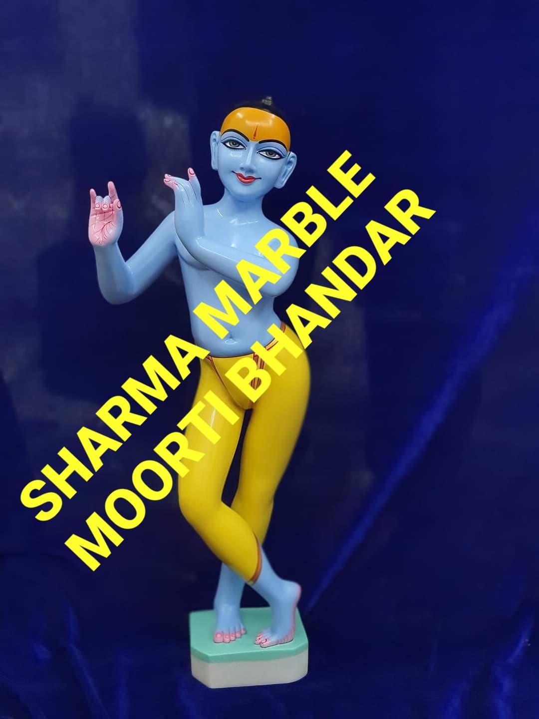 White Marble Iskon Krishna Moorti Painted With Yellow And Blue Color